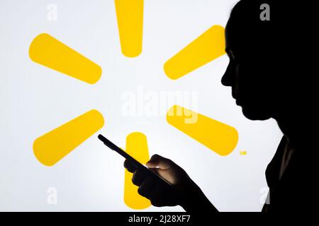 https://l450v.alamy.com/450v/2j28xf7/brazil-30th-mar-2022-in-this-photo-illustration-a-womans-silhouette-holds-a-smartphone-with-the-walmart-logo-in-the-background-photo-by-rafael-henriquesopa-imagessipa-usa-credit-sipa-usaalamy-live-news-2j28xf7.jpg
