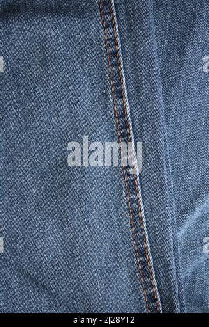 A Gold Thread Seam on a Pair of Classic Blue Jeans Stock Photo