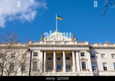 Ukrainian flag flying at Somerset House to show solidarity and support for the country and people of Ukraine following the Russian invasion. London UK Stock Photo