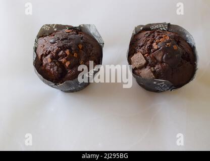 Chocolate cupcakes on light background. Stock Photo