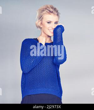 Posing with confidence. Studio shot of a beautiful young woman posing in the studio. Stock Photo