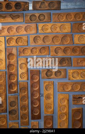 Wall full of Chinese moon cake moulds hanging on the wall Stock Photo