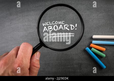 Welcome Aboard. Business or education concept. Text on a blackboard. Stock Photo