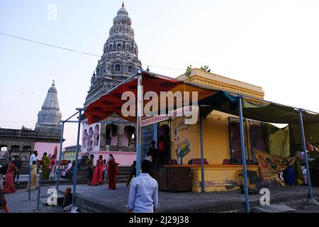 Pandharpur, India, 26 February 2022, Chandrabhaga Ghat and pundalikas temple on the bank of river chandrabhaga and people doing religious rites. Stock Photo