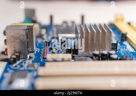 Close up of a motherboard, details of a computer motherboard, detail of a motherboard socket, three processors on a computer motherboard Stock Photo