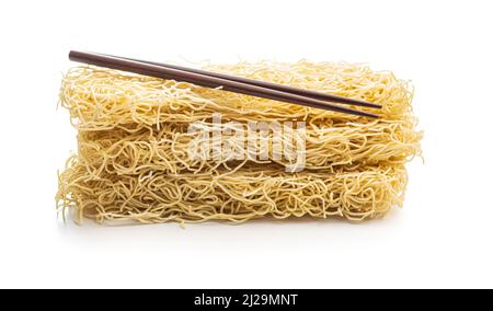 Instant noodles. Uncooked chinese noodles isolated on a white background. Stock Photo
