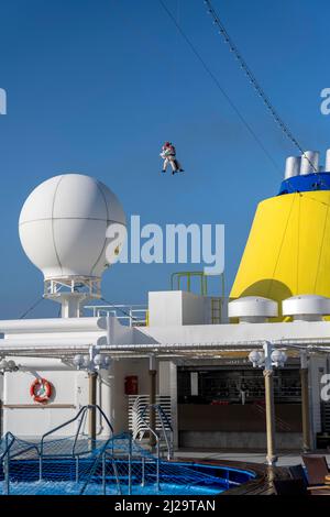 Two doctors are roped down from a helicopter onto a cruise ship. Corona tests are to be carried out in the Atlantic Ocean at the height of Argentina. Stock Photo