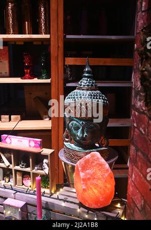 buddha statue in shop window, bury st edmunds, england Stock Photo