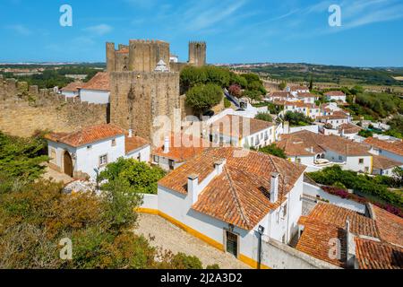 Rooftops of town and medieval fortress. Obidos. Portugal Stock Photo