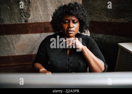 Female financial expert using computer in law office Stock Photo