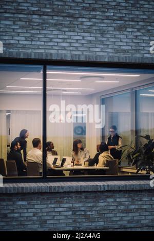 Multiracial business colleagues working late in office Stock Photo