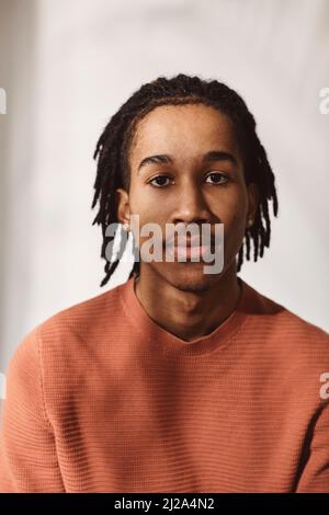 Portrait of young man against white background Stock Photo - Alamy