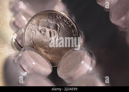 Five cent coin on a pack of pills Stock Photo