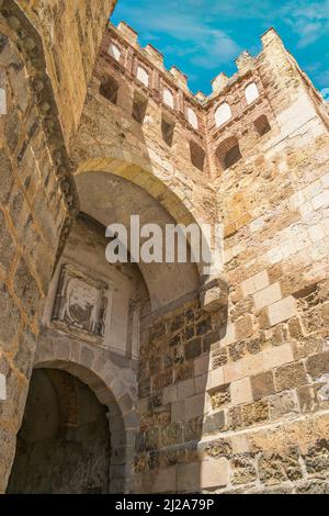 A vertical low angle shot of the Puerta de San Andres city gate in Segovia, Spain Stock Photo