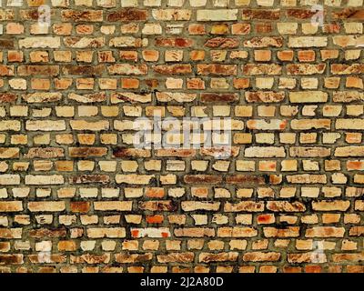 Wall made of old yellow bricks as background Stock Photo