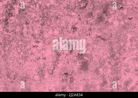 Scattered dark grunge texture on a pink painted concrete wall Stock Photo