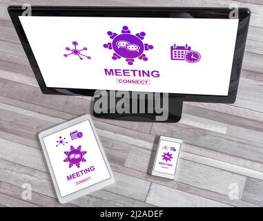 Meeting concept shown on different information technology devices Stock Photo