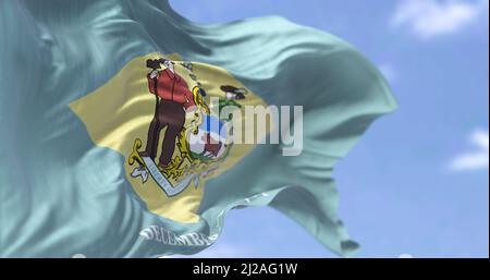 The state flag of Delaware waving in the wind. Delaware is a state in the Mid-Atlantic region of the United States. Democracy and independence. US sta Stock Photo