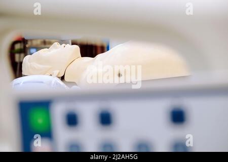 Image of CPR dummy with defibrillator Stock Photo