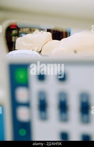 Image of CPR dummy with defibrillator Stock Photo