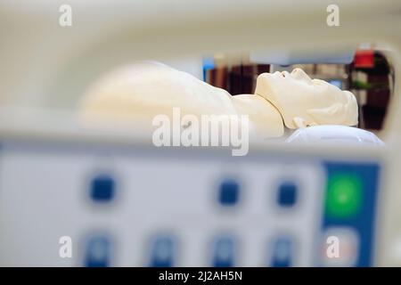 Image of CPR dummy with defibrillator Stock Photo