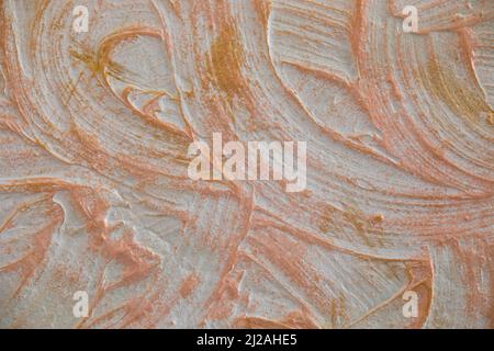 Stucco wall with gold paint Stock Photo