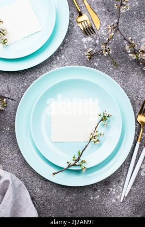 Spring table setting with blooming branch Stock Photo
