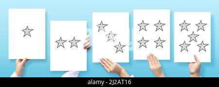 customer experience concept , customer holding paper with satisfied review by star rating feedback for review business service Stock Photo