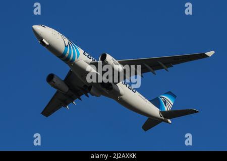 An Airbus A330 Freighter operated by EgyptAir Cargo departs from London Heathrow Airport Stock Photo