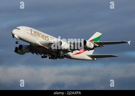 An Airbus A380 operated by Emirates departs from London Heathrow Airport Stock Photo