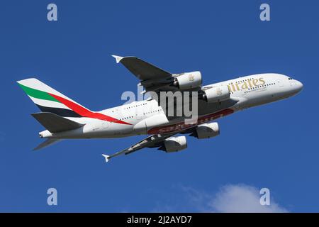 An Airbus A380 operated by Emirates departs London Heathrow Airport Stock Photo