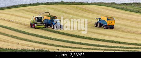 Ballycastle. UK. 06.22.16. Agriculture - collecting silage in the fields near Ballycastle in County Antrim, Northern Ireland. Silage is grass fodder t Stock Photo