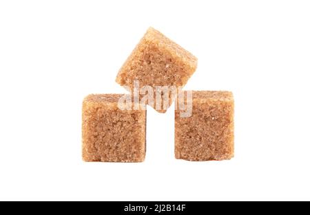 Three cubes of refined cane sugar isolated on white background. Close up. Stock Photo