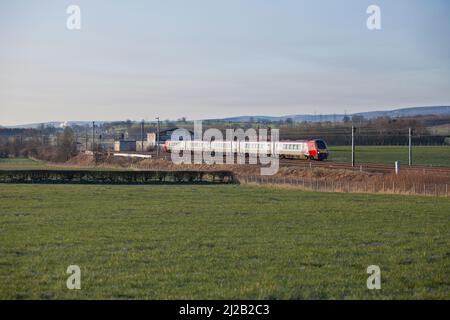 Virgin trains west coast diesel voyager train 221101 on the electrified west coast mainline in Cumbria Stock Photo