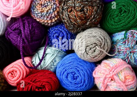 Full frame of colorful, assorted yarns Stock Photo