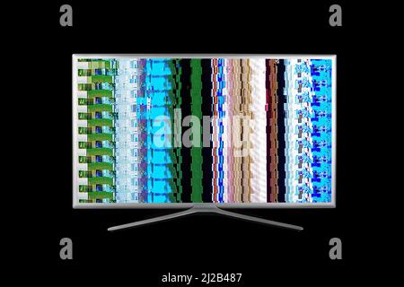 grey 4K television with digital glitches, distortions on the screen isolated  on a black background Stock Photo