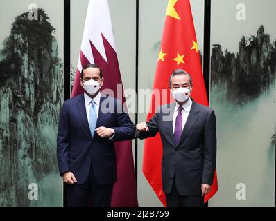 Hefei, China's Anhui Province. 30th Mar, 2022. Chinese State Councilor and Foreign Minister Wang Yi meets with Qatari Deputy Prime Minister and Foreign Minister Sheikh Mohammed bin Abdulrahman Al Thani in Tunxi, east China's Anhui Province, March 30, 2022. The Qatari top diplomat is in China to attend the 'neighboring countries of Afghanistan plus Afghanistan' foreign ministers' dialogue. Credit: Zhou Mu/Xinhua/Alamy Live News Stock Photo