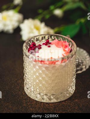 Handmade candles of a unique design, with different flowers, dry leaves on  a light background. Candles made from organic wax, paraffin wax. Relaxation  Stock Photo - Alamy