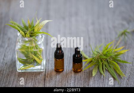 Hemp oil bottle Cannabis products for medical use Including hemp leaves, CBD and CBD hemp oil capsules. Stock Photo