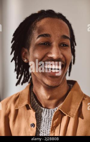 Happy young man looking away in studio Stock Photo
