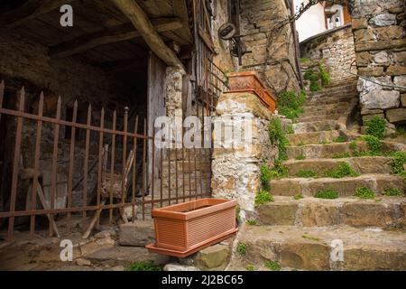 A residential street in Poffabro, an historic medieval village in the Val Colvera valley, Pordenone province, Friuli-Venezia Giulia, north east Italy Stock Photo