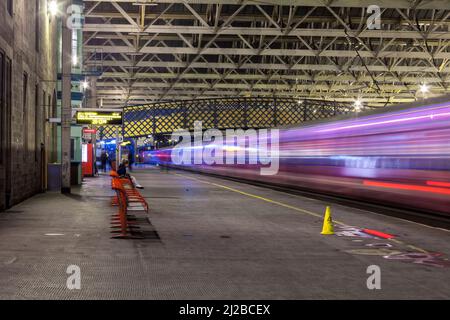 Motion blur with a First group dynamic lines livery class 350 train arriving at Carlisle railway station in the west coast mainline Stock Photo