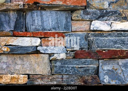 Walls made of multicolor stones , Stone background. Ancient stone wall. Grunge stone wall backdrop. Background of old vintage stone wall. Wall decorat Stock Photo