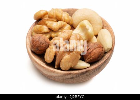 Mixed nuts in wooden shell isolated against white background Stock Photo