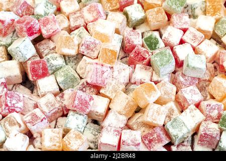 fruit paste sugar covered different colors candy background, top view Stock Photo