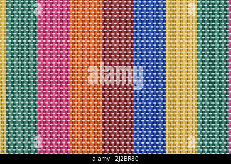 Texture - multi-colored plastic threads intertwined make up the surface for the table. Closeup. Macro. Stock Photo