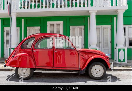 Shiny red Citroën 2CV in the streets of Willemstad, Curacao Stock Photo