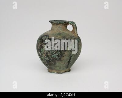 This precious bronze object is a votive, or devotional gift, made for gods. They come in many forms. Some are miniature sculptures of animals, mostly depicting horses, deer, and birds. Others are items of personal adornment, including beads and brooches. Quite a few seem once to have been attached to something else. Thousands of votives that were hung from sacred trees or placed in sanctuaries around Greece. Once a shrine was full, the votives were gathered together and ceremonially buried to make room for more offerings. This votive comes from Thessaly in northeastern Greece. Stock Photo