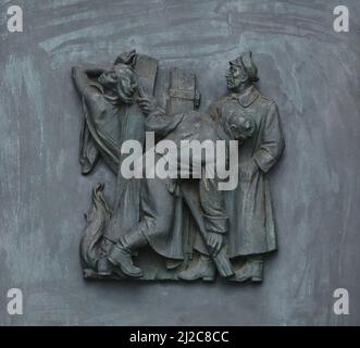 Slovak woman burned by the Nazis in her house during World War II depicted in the bronze relief by Slovak sculptor Rudolf Pribiš placed on the main door to the Slavín Memorial in Bratislava, Slovakia. The war memorial devoted to Red Army soldiers fallen during World War II was designed by Slovak architect Ján Svetlík and build between 1957 and 1960. Stock Photo