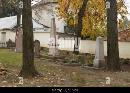 Graves of Russian Orthodox priests at the Russian Cemetery next to the Russian Chapel of Alexandra Pavlovna in Üröm near Budapest, Hungary. The church was built between 1801 and 1803 over the tomb of the Grand Duchess Alexandra Pavlovna of Russia (1783-1801) and is known as the oldest Russian Orthodox Church in Western Europe. Stock Photo